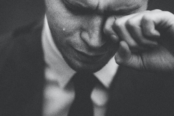 black-and-white-photo-of-man-crying